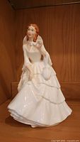 Front view of Royal Doulton Barbara HN2962 porcelain figurine showing full detail of face, hair, and dress.