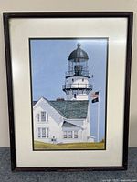 Framed print of Cape Elizabeth Light showcasing the lighthouse and building under a clear blue sky.