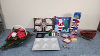 Full lot display of Christmas themed items arranged on a table showing all items from the seller description.