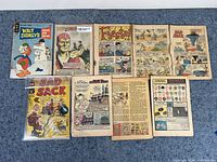 Image of all 8 vintage comics laid out in two rows on carpet background. Shows covers and inner pages with colorful illustrations.