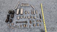 Larger view shows assortment of sockets and attachments laid out with measuring tape showing length dimension reference.