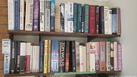 Shelf showing a broader selection including historical stories, fiction, and prose with multiple authors and titles.