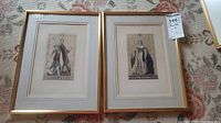Two framed prints side by side on a floral carpet background, showing Prince Albert and Victoria Regina portraits.