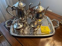 Full view of the 5-piece tea set on the ornate serving tray