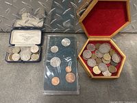 Coins in three different storage/display forms showing variety and condition