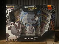Front view of the sealed Pokemon Champion's Path Dubwool V collection box showing the foil promo card and packaging design