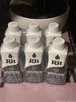 Six bottles of RIT black fabric dye in original packaging, unopened.