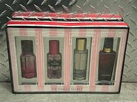 Boxed set of four Victoria's Secret perfumes in original packaging, visible through front window.