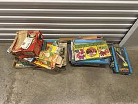 Lot of vintage board games including Rotoword and The Phantom seen in storage bin.