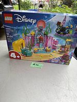 Photo of sealed LEGO Disney set 43254 Ariel's Magical Crystal Palace with box art showing palace, slide, boat, and underwater decorations