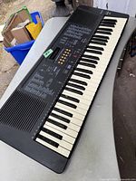 Full view of the Panasonic KZ-250 PCM keyboard showing 49 keys, speaker grill on the left, and central control panel with buttons and dial.