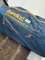 Storage bag for Eureka Northern Breeze 10 tent showing model name, brand and dimensions printed on side
