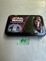Metal collector tin with Star Wars Episode 1 front graphics shown