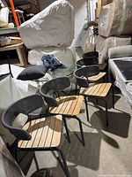 Four matching chairs arranged in a row showing overall appearance