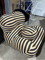 Front view of striped chair and ball ottoman