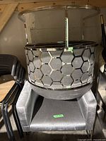 Chair stacked under metal hexagon back chair frame