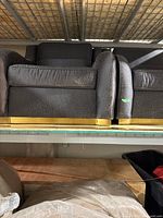 Front view of two matching armchairs showing seat cushions and backrests