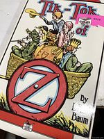 Close-up photo of the book cover showing the title 'Tik-Tok of Oz' and illustrated characters.