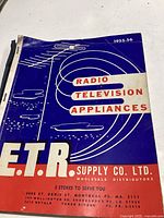 Front cover of the 1955-56 E.T.R. Supply Co. Ltd. catalogue featuring radio and television appliances, blue and white design.