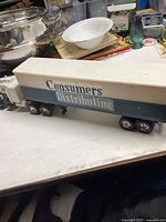 Side view of the trailer with Consumers Distributing logo