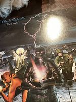 Front cover of the Black Sabbath Live Evil album showing the knight with sword and lightning.