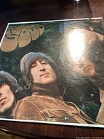 Front cover photo of the album Rubber Soul by The Beatles showing the band members and distinctive title lettering.
