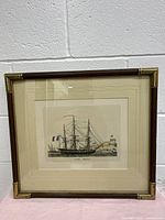 Framed color engraving of ship 'Corvetta Francese' hung on a wall, showing full artwork and frame details