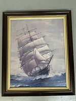 Full view of large framed artwork showing the clipper ship with white sails on the ocean.