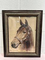 Frontal view of the framed horse print titled Tarada showing the horse head portrait, signature, and plaque.
