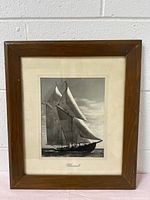 Full view of the framed vintage black and white photo of the sailing ship Bluenose II in wooden frame.