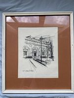 Full view of the framed screen print showing the Art Gallery of Ontario building front with brown matting and white wooden frame.