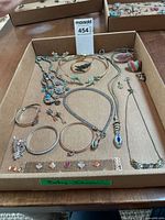 Tray showing all necklaces, bracelets, earrings and ring
