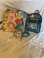 Group shot showing tote, mini backpack and coin purse