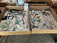 Two trays containing mixed costume necklaces and one bangle