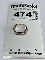 Ring displayed on lot card showing full band and diamonds