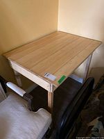 Full view of wooden table in corner showing overall design