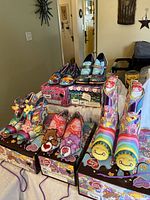 Group shot showing all five shoe pairs with original boxes