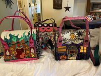 Front view of three Irregular Choice handbags showing motifs and handles