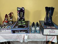 Four pairs of Irregular Choice footwear displayed on original boxes