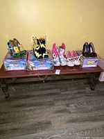 Overview of all five shoe pairs on bench