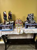 All three shoe pairs on boxes