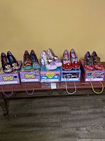 All six shoe pairs on boxes