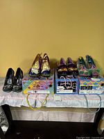 All four pairs of pumps on their boxes