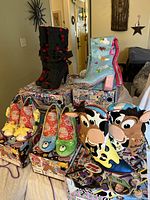 Group shot of all five boxed pairs; four pairs shown atop boxes