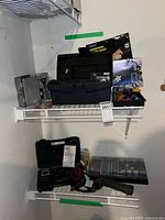 Shelf view showing tool cases, bags, flashlight, organizer with batteries