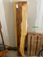 Full view of one slab showing natural light/dark grain