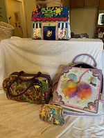 Group shot of all four novelty bags displayed together