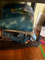 Stack of Ripndip garments on shelf