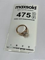 Ring on lot card showing overall appearance and size reference