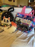 Overview of both bags showing tote design and round cat bag front